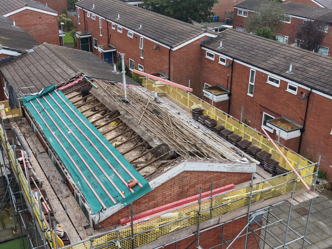 Terrace re-roof seen from above, stripped back with battens going on