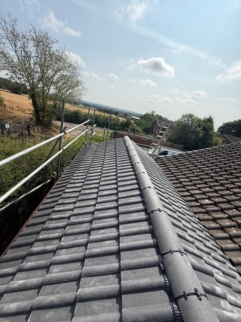 New grey tile ridge with fields behind